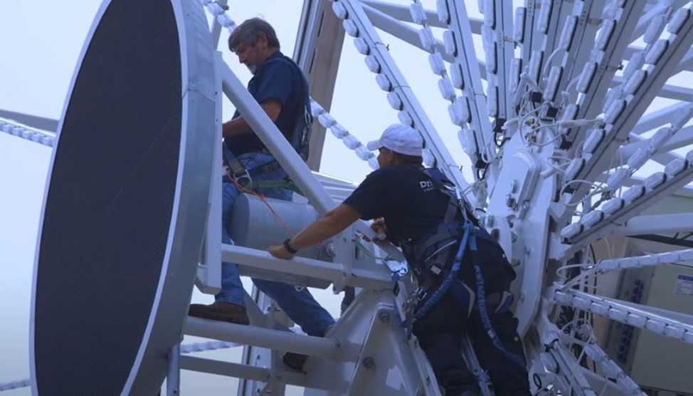 Chance Rides employees working on wheel.
